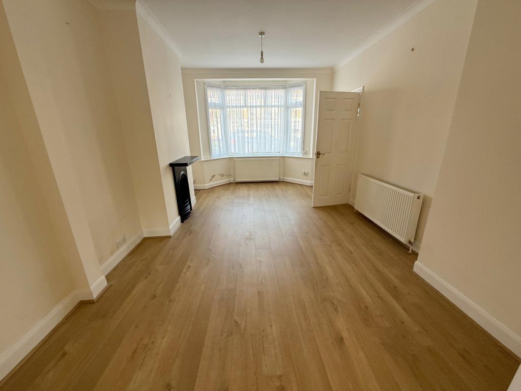 Lot: 59 - THREE-BEDROOM HOUSE FOR REPAIR AND IMPROVEMENT - Living room with window to front aspect